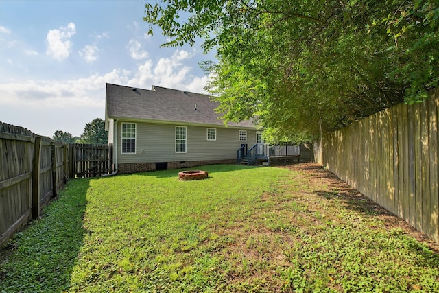 7 Summerfield Dr, Fayetteville, TN 37334 - back of house featuring a wooden deck, crawl space, a fenced backyard, an outdoor fire pit, and a shingled roof
