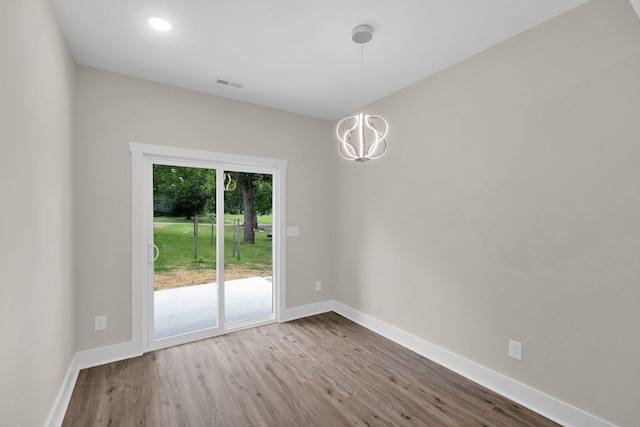 1104 Bridge St, Columbia, TN 38401 - unfurnished room featuring wood finished floors, a chandelier, and recessed lighting