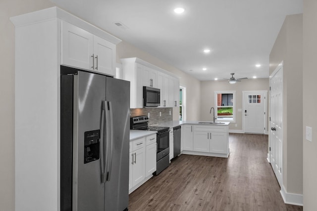 1104 Bridge St, Columbia, TN 38401 - kitchen featuring stainless steel appliances, a peninsula, dark wood finished floors, recessed lighting, and a ceiling fan