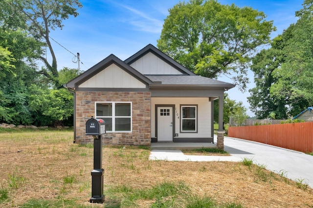 1104 Bridge St, Columbia, TN 38401 - view of front of home featuring covered porch, board and batten siding, and stone siding