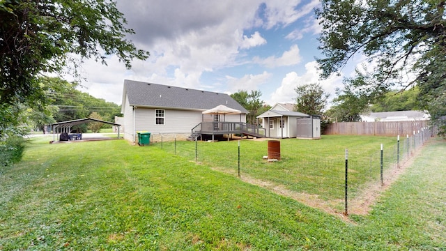 341 Holly Grove Rd, Lewisburg, TN 37091 - rear view of property with a storage shed, a deck, and a detached carport