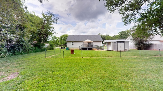 341 Holly Grove Rd, Lewisburg, TN 37091 - fenced backyard featuring a deck and a storage unit