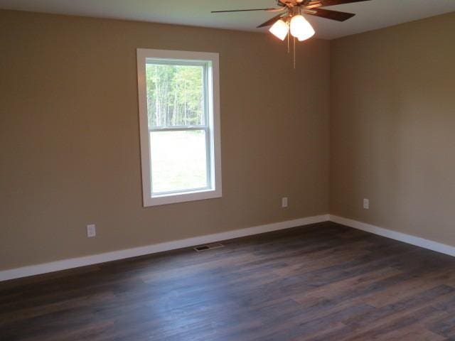 2300 Charlie Davis Rd, Goodspring, TN 38460 - unfurnished room with a ceiling fan and dark wood-type flooring