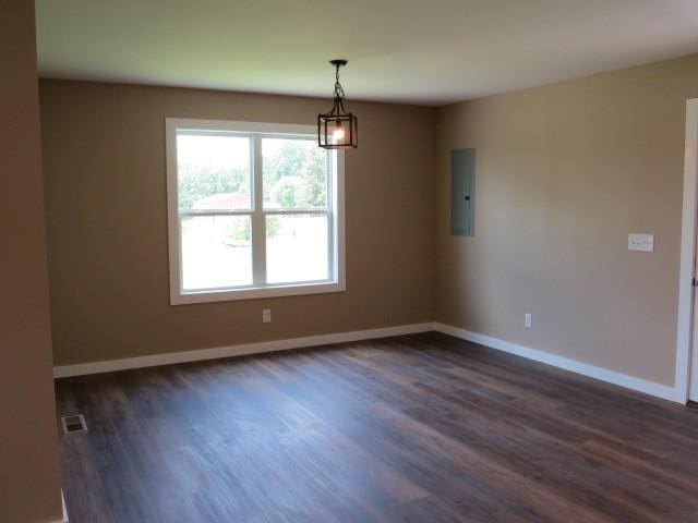 2300 Charlie Davis Rd, Goodspring, TN 38460 - empty room with dark wood finished floors and electric panel