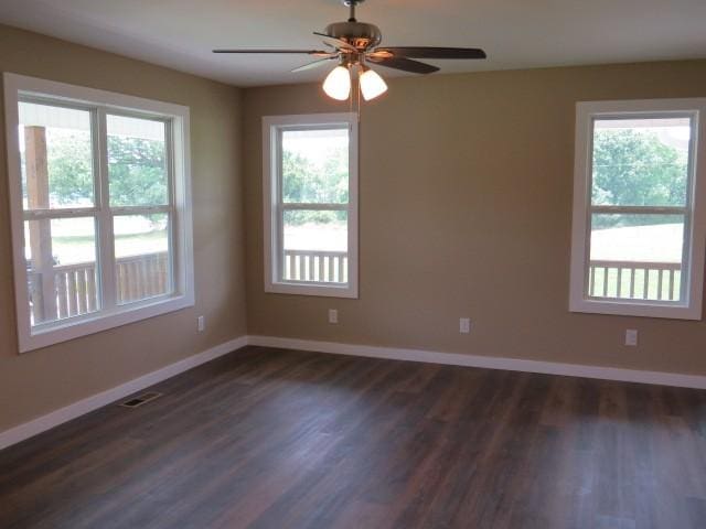 2300 Charlie Davis Rd, Goodspring, TN 38460 - spare room featuring plenty of natural light, a ceiling fan, and dark wood-type flooring