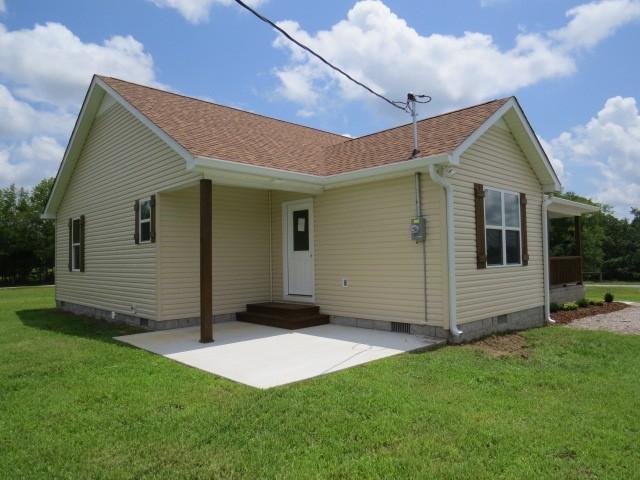 2300 Charlie Davis Rd, Goodspring, TN 38460 - view of front of property featuring crawl space, a patio, a front lawn, and a shingled roof