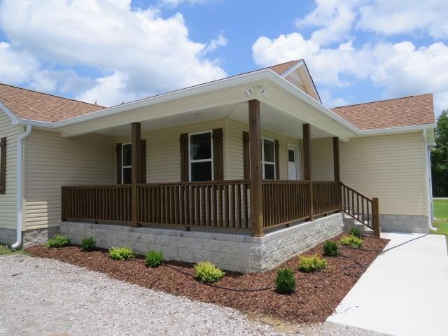 2300 Charlie Davis Rd, Goodspring, TN 38460 - view of home's exterior with covered porch and roof with shingles