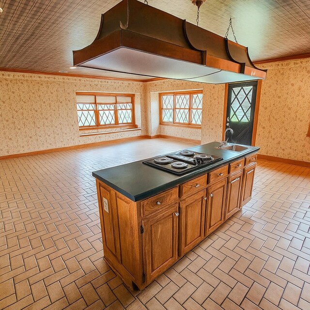 4623 Lebanon Rd, Murfreesboro, TN 37129 - kitchen featuring electric cooktop, wallpapered walls, brick floors, dark countertops, and exhaust hood