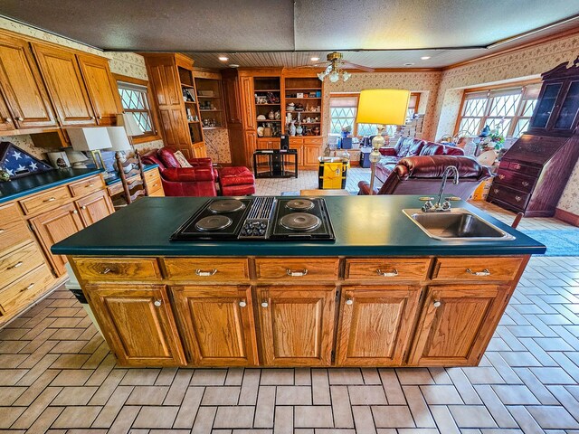 4623 Lebanon Rd, Murfreesboro, TN 37129 - kitchen with stovetop with downdraft, dark countertops, healthy amount of natural light, brown cabinetry, and a textured ceiling