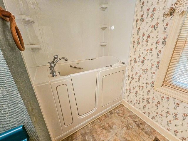 4623 Lebanon Rd, Murfreesboro, TN 37129 - bathroom featuring wallpapered walls, a tub, stone finish flooring, and a shower