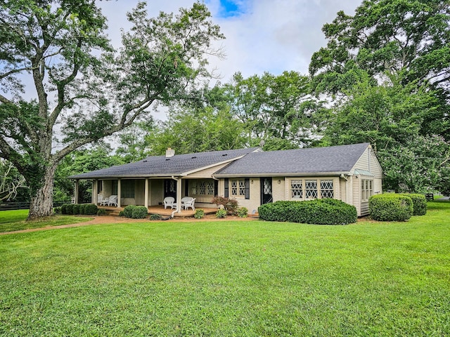 4623 Lebanon Rd, Murfreesboro, TN 37129 - view of front of house with a chimney, a front lawn, and a shingled roof