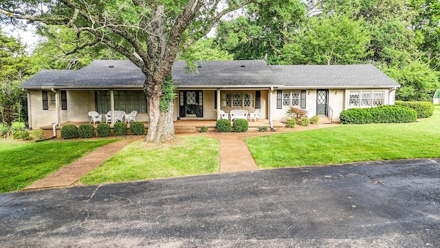 4623 Lebanon Rd, Murfreesboro, TN 37129 - view of front of home featuring a porch, a front lawn, brick siding, and a shingled roof