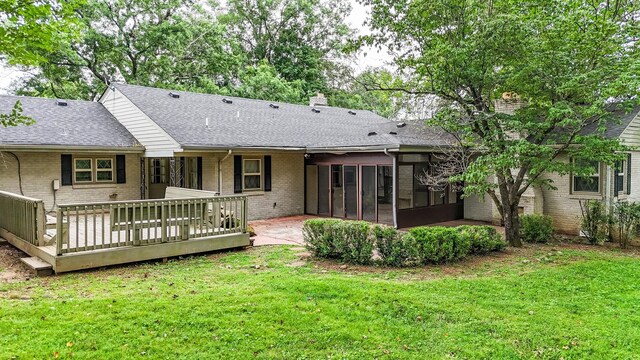 4623 Lebanon Rd, Murfreesboro, TN 37129 - back of house featuring a sunroom, brick siding, a lawn, a shingled roof, and a chimney
