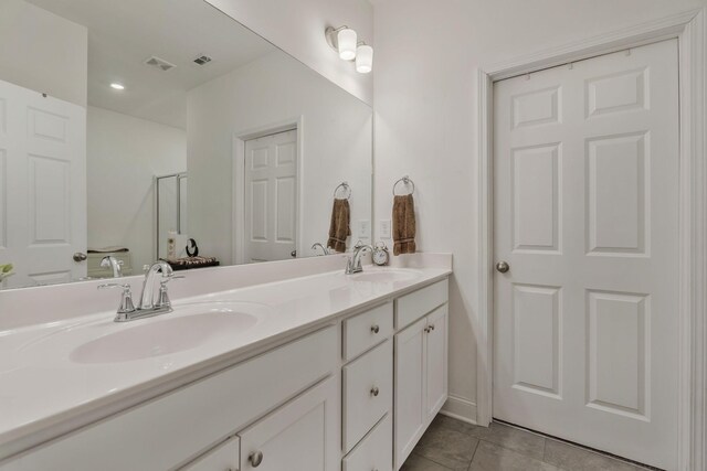 2326 Laurelstone Dr, Murfreesboro, TN 37130 - bathroom featuring double vanity, tile patterned floors, and a shower with door