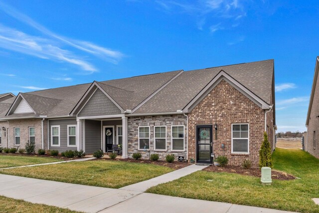 2326 Laurelstone Dr, Murfreesboro, TN 37130 - view of front of home featuring a front yard, brick siding, and a shingled roof