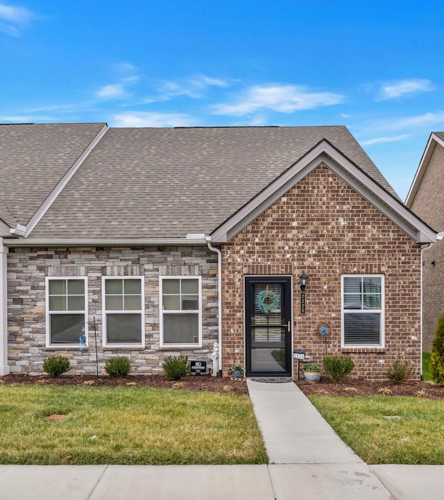 2326 Laurelstone Dr, Murfreesboro, TN 37130 - view of front of property featuring roof with shingles, a front lawn, and brick siding