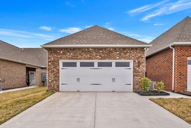 2326 Laurelstone Dr, Murfreesboro, TN 37130 - view of side of home with a shingled roof, brick siding, driveway, and an attached garage