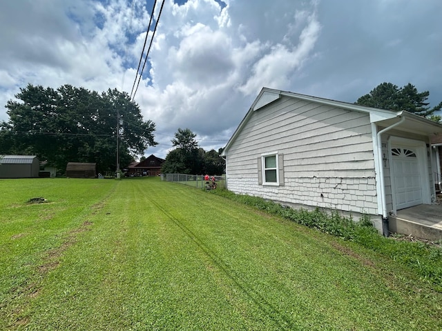 217 Millcreek Dr, Loretto, TN 38469 - view of green lawn featuring an attached garage