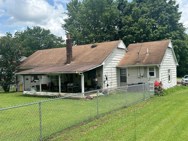 217 Millcreek Dr, Loretto, TN 38469 - back of property featuring a chimney, a fenced backyard, and roof with shingles