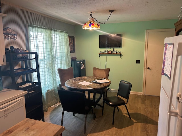 217 Millcreek Dr, Loretto, TN 38469 - dining area with a textured ceiling and wood finished floors