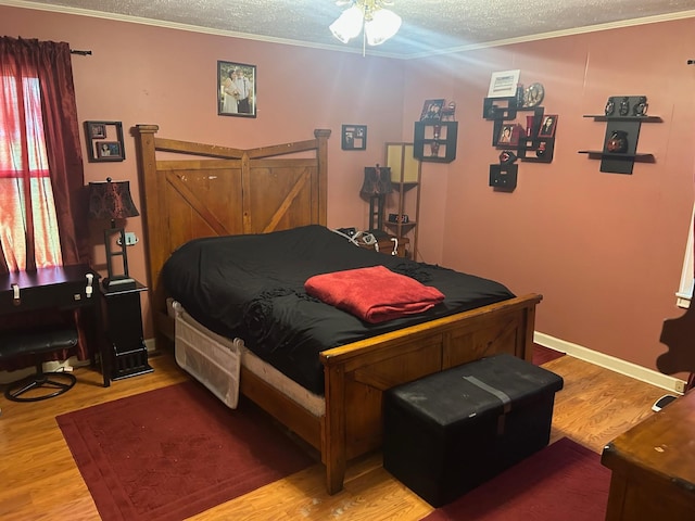 217 Millcreek Dr, Loretto, TN 38469 - bedroom with a textured ceiling, light wood finished floors, and crown molding