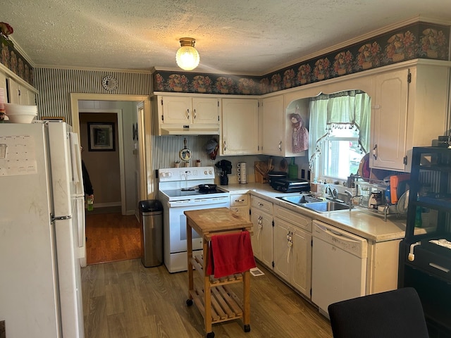 217 Millcreek Dr, Loretto, TN 38469 - kitchen featuring white appliances, a textured ceiling, under cabinet range hood, light countertops, and light wood-type flooring