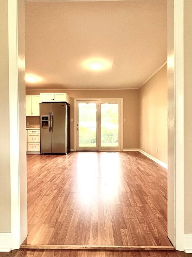 210 Roney Dr, Hopkinsville, KY 42240 - unfurnished living room with light wood finished floors and crown molding