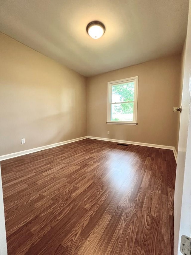 210 Roney Dr, Hopkinsville, KY 42240 - empty room featuring dark wood-type flooring and baseboards