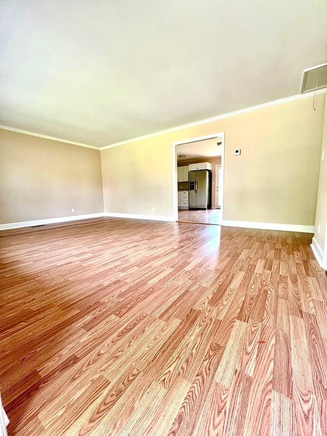 210 Roney Dr, Hopkinsville, KY 42240 - spare room with light wood finished floors, crown molding, and attic access