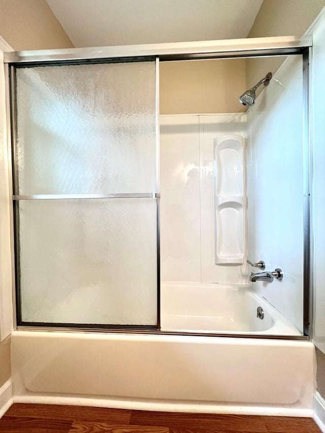 210 Roney Dr, Hopkinsville, KY 42240 - bathroom featuring wood finished floors and enclosed tub / shower combo