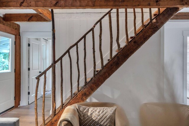 8014 Shoals Branch Rd, Primm Springs, TN 38476 - stairway featuring wood finished floors and beam ceiling