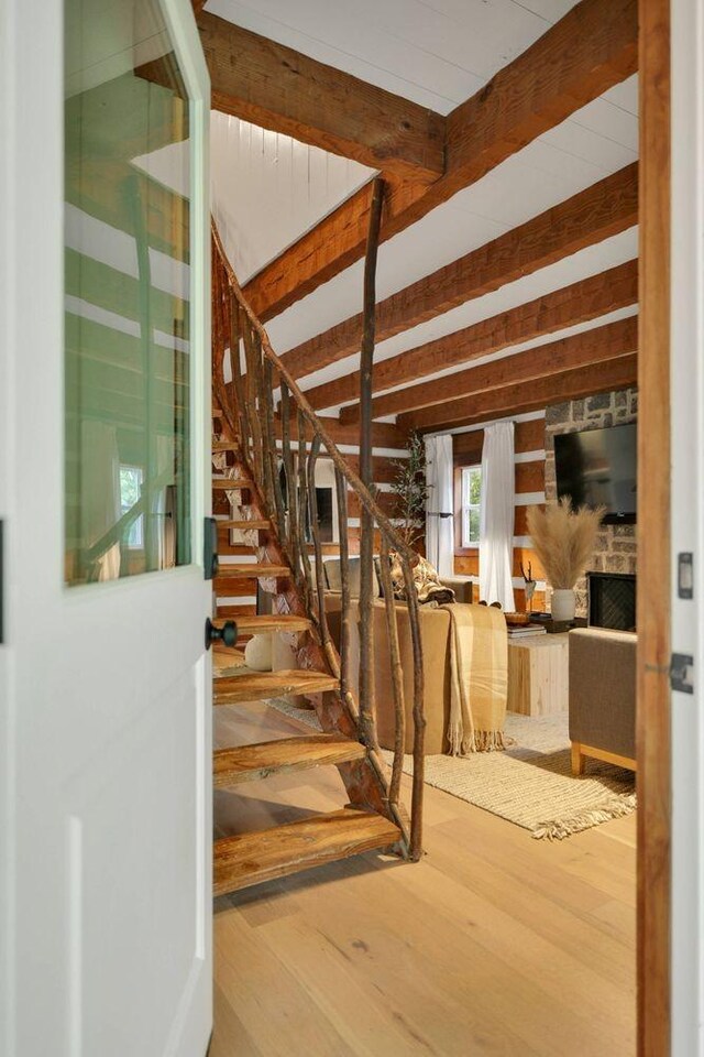 8014 Shoals Branch Rd, Primm Springs, TN 38476 - stairway with wood finished floors and beamed ceiling
