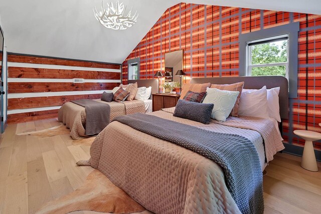 8014 Shoals Branch Rd, Primm Springs, TN 38476 - bedroom featuring wood finished floors, vaulted ceiling, and wood walls