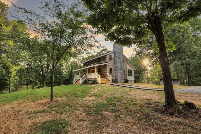 8014 Shoals Branch Rd, Primm Springs, TN 38476 - view of front of property with a chimney, covered porch, and a lawn