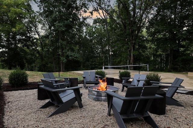 8014 Shoals Branch Rd, Primm Springs, TN 38476 - patio terrace at dusk with an outdoor fire pit