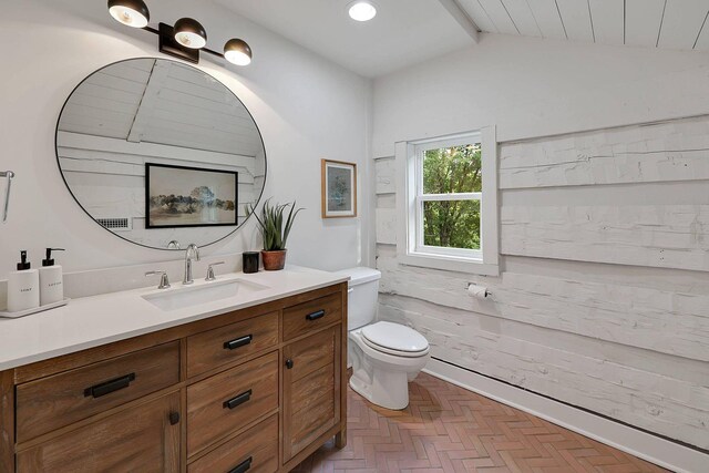 8014 Shoals Branch Rd, Primm Springs, TN 38476 - bathroom with vaulted ceiling, vanity, and recessed lighting