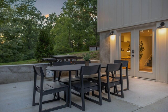8014 Shoals Branch Rd, Primm Springs, TN 38476 - patio terrace at dusk with a patio area and outdoor dining area