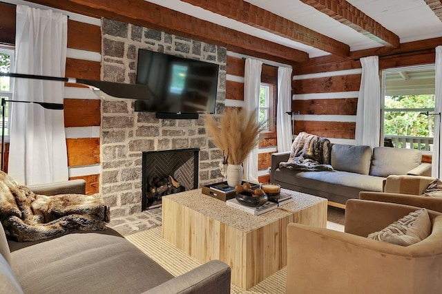 8014 Shoals Branch Rd, Primm Springs, TN 38476 - living room with plenty of natural light, beam ceiling, a stone fireplace, and wood walls