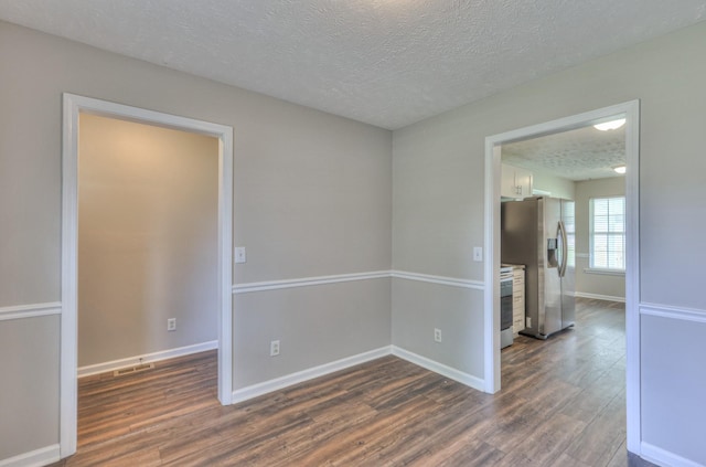 212 Towbridge Dr, Murfreesboro, TN 37129 - spare room with dark wood finished floors and a textured ceiling