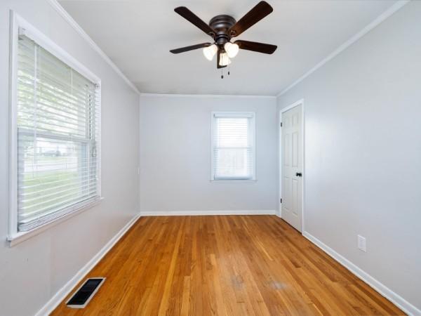1905 Highland Ave, Columbia, TN 38401 - empty room with crown molding, light wood-style floors, and a ceiling fan