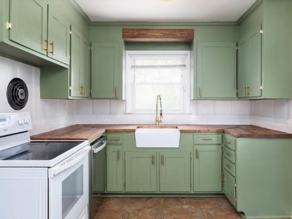 1905 Highland Ave, Columbia, TN 38401 - kitchen featuring green cabinets, white electric stove, dishwasher, and crown molding
