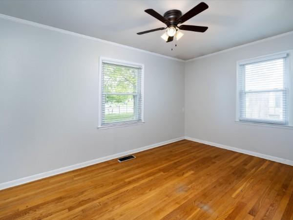 1905 Highland Ave, Columbia, TN 38401 - unfurnished room with crown molding, light wood-type flooring, and ceiling fan