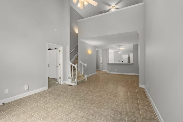 231 Green Harbor Rd Unit 59, Old Hickory, TN 37138 - unfurnished living room with high vaulted ceiling, stairway, a ceiling fan, and tile patterned floors