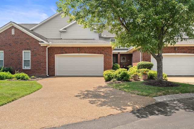 231 Green Harbor Rd Unit 59, Old Hickory, TN 37138 - traditional home featuring concrete driveway, brick siding, a garage, and a shingled roof
