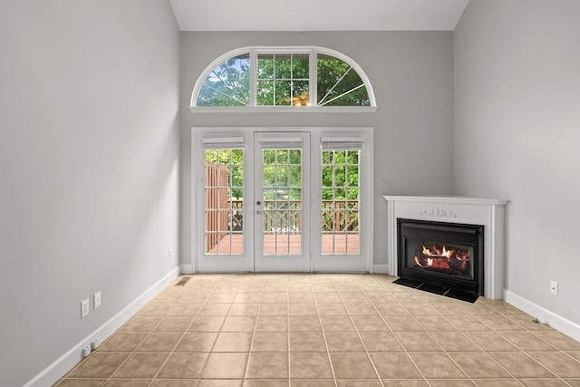 231 Green Harbor Rd Unit 59, Old Hickory, TN 37138 - unfurnished living room featuring a fireplace with flush hearth and tile patterned floors