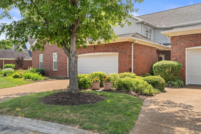 231 Green Harbor Rd Unit 59, Old Hickory, TN 37138 - view of home's exterior featuring brick siding, an attached garage, and driveway