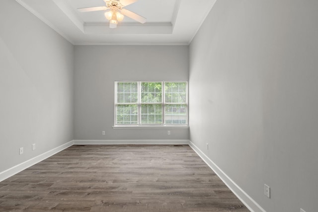 231 Green Harbor Rd Unit 59, Old Hickory, TN 37138 - spare room with a raised ceiling, ceiling fan, dark wood-style flooring, and ornamental molding