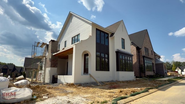 9381 Calder Cir, Ooltewah, TN 37363 - view of home's exterior featuring brick siding and stucco siding
