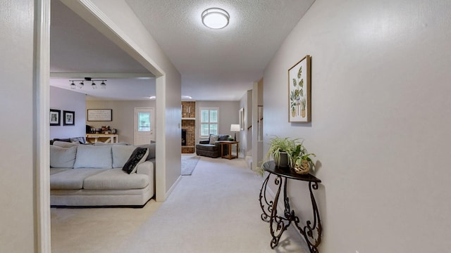1335 Chippendale Cir, Columbia, TN 38401 - carpeted living area with a textured ceiling and a brick fireplace