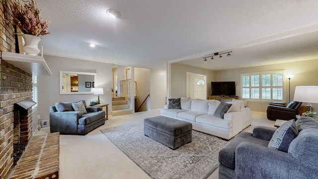 1335 Chippendale Cir, Columbia, TN 38401 - carpeted living area with stairs, a brick fireplace, and rail lighting